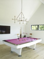 Game room with pink felt pool table