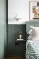 Detail of bedroom makeover with green panelling.