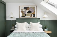 Loft bedroom makeover with green panelling.