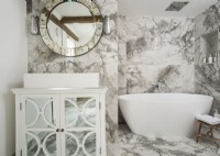 White and grey marble bathroom with mirrored cabinet