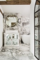Grey and white marbled classic bathroom with mirrored cabinet