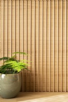 Detail in office of wooden slatted wall.