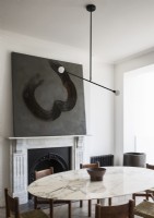 Contemporary marble Dining Table with ceiling light and marble fireplace