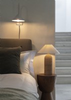 Bedside lights with staircase in background