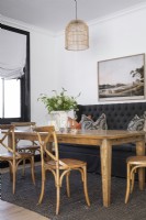 Dining room with a mix of chairs and banquette seating