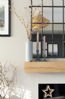 Shelf detail with catkins and industrial style mirror