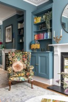 Bold colourful sitting room with botanical printed chair