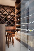 Refrigerated wine cellar with bar