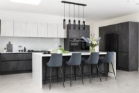 Contemporary monochrome kitchen with large island.