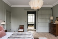 Large classic modern bedroom with barn style sliding door and en-suite.