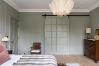 Large classic modern bedroom with barn style sliding door. 